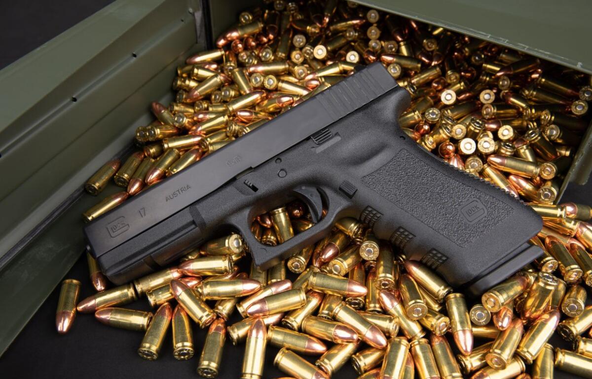 Glock 17 9mm Handgun with ammo box