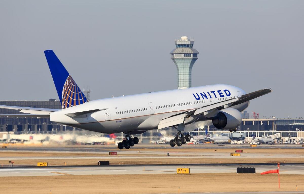 Chicago, Illinois, USA - March 19, 2017: United Airlines Boeing 777 passenger jet airplane arriving for a landing at O'Hare International Airport in Chicago, Illinois, USA.