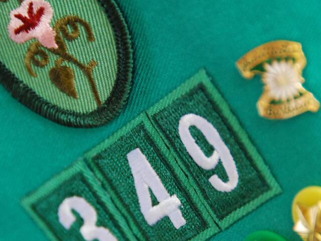 Girl Scout badge with sash